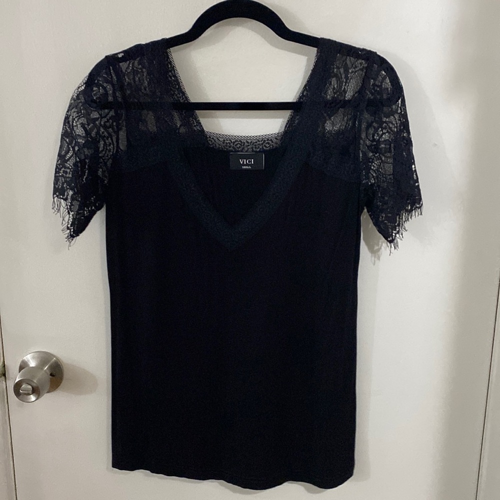 Black t-shirt - lace sleeves. Never worn, tags removed